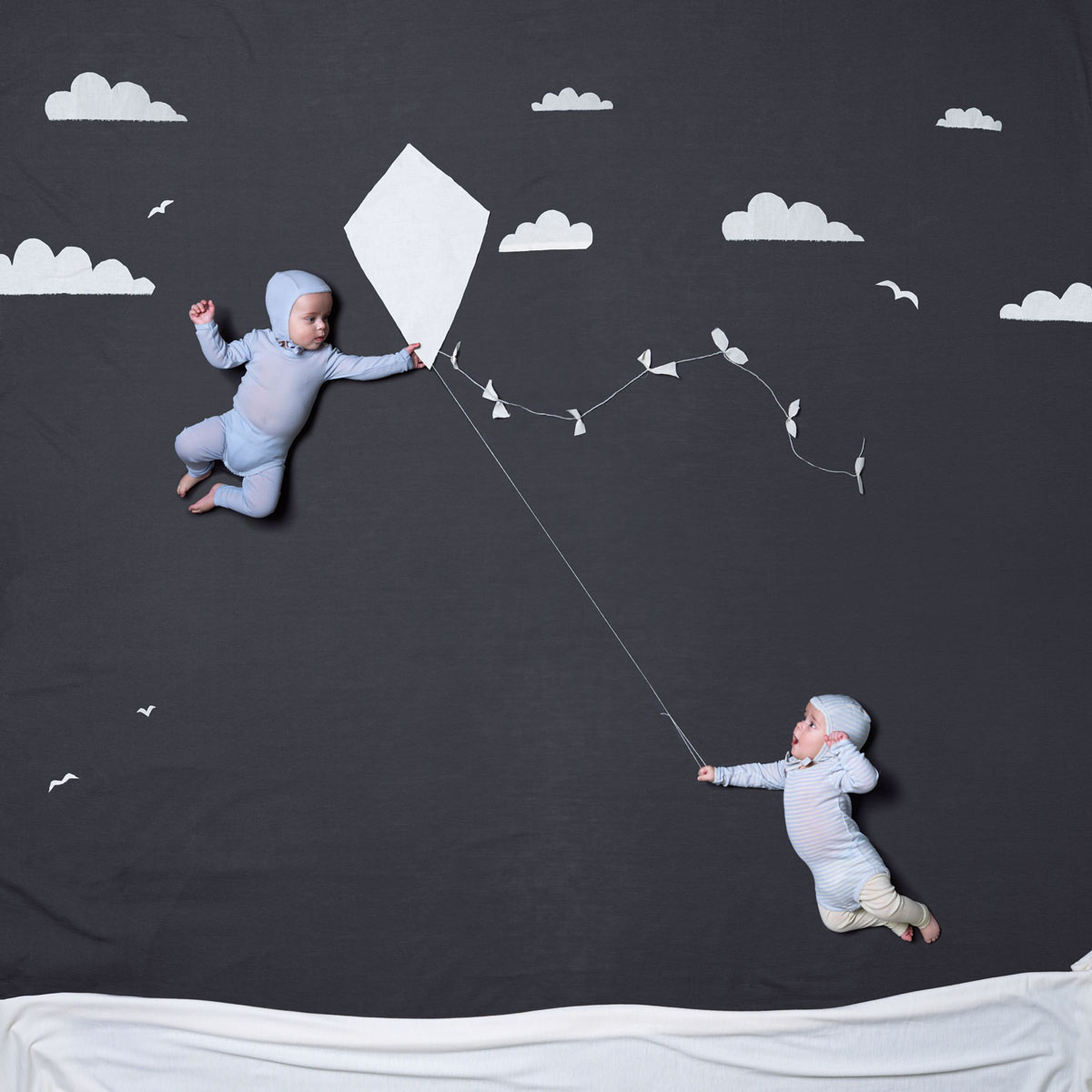 Twin boys playing with a kite. Advertising for Norwegian wool brand Lilli Leopold by håvard schei